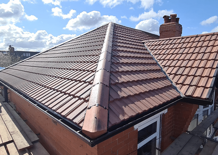 Newly completed brown tiled hipped roof on a Staffordshire property
